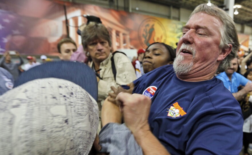 A Trump supporter and protester get into a scuffle at a rally in Richmond, Va., in October. Protests and violence are becoming more frequent at Trump rallies, but they have been going on for months.