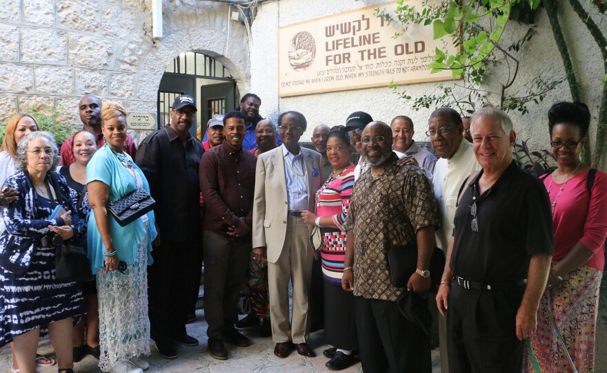 African-American evangelical leaders visited a Jerusalem crafts workshop for elderly Israelis, a project supported by the International Fellowship of Christians and Jews. The group and Israel's tourism ministry sponsored the pastors' trip to Israel, part of the Fellowship's new outreach effort to African-American congregations.