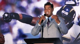 Junior Seau is shown speaking to fans and the media during a news conference announcing his retirement from pro football on Aug. 14, 2006.
