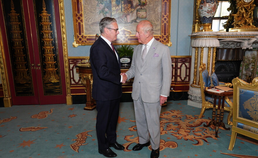Britain's King Charles III welcomes outgoing Prime Minister Keir Starmer, during an audience at Buckingham Palace in London, Monday July 20, 2026.