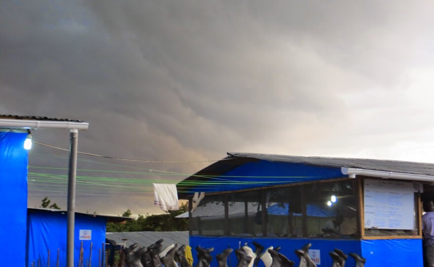 One morning, Dr. Kwan Kew Lai and another nurse went into the treatment center at 3 a.m. to administer IV fluids. Deafening thunder and rain came pelting on the tinned roof.