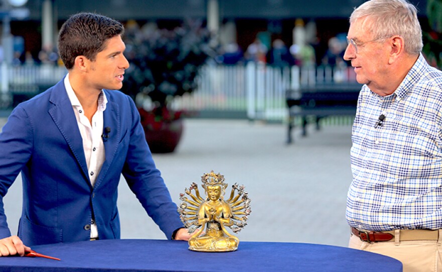 Robert Waterhouse (left) appraises a Chinese gilt bronze Bodhisattva, ca. 1650 at Churchill Downs Racetrack in Louisville, Ky.