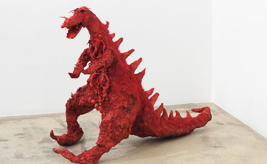 Niki de Saint Phalle's "Red Dragon," (1964), an assemblage of plaster, mesh fabric, spray paint, string, hair and plastic figures.