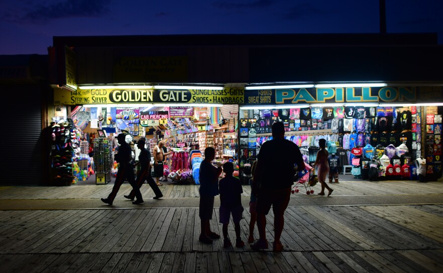 People walk the boardwalk on July 3 in Wildwood, New Jersey, after some coronavirus restrictions were lifted. There's concern that case counts could push back up in Mid-Atlantic and Northeastern states.