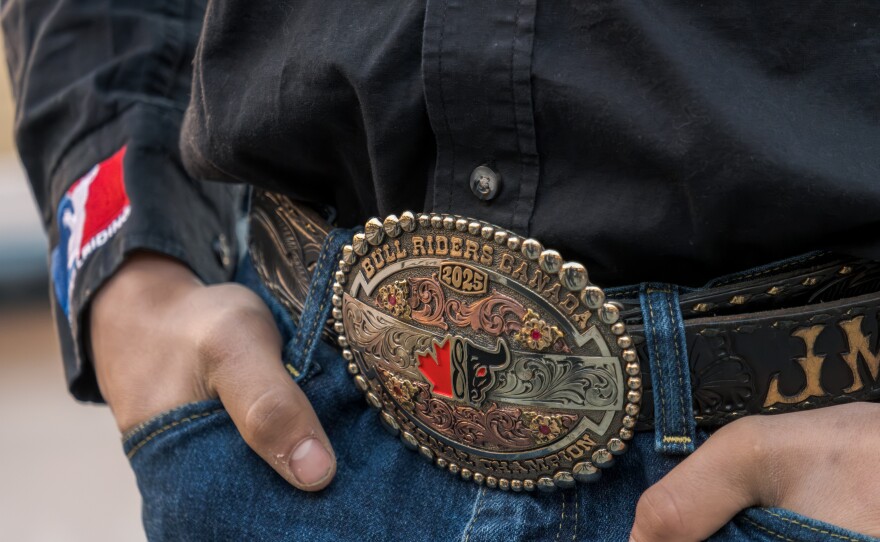Bull rider Jeremy Maisonneuve wear a large belt buckle, marking a previous championship, Jan. 15, 2026.