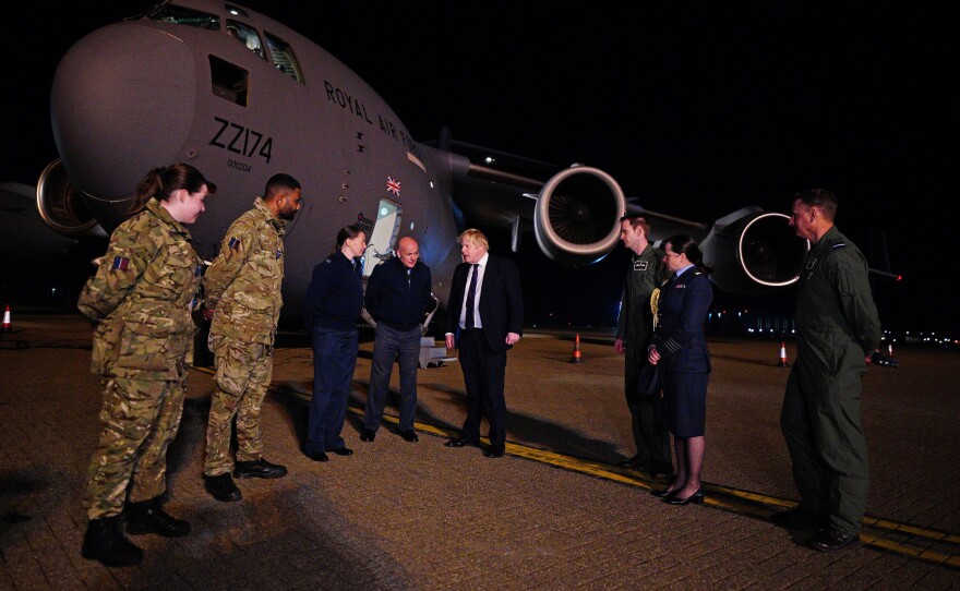 British Prime Minister Boris Johnson meets military personnel at RAF Brize Norton to thank them for their work facilitating military support to Ukraine and NATO, on Feb. 26 at Brize Norton, Oxfordshire, England.