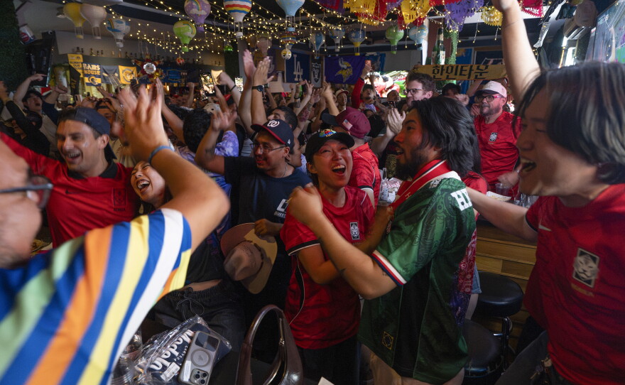 Josh Lee and members of the Los Angeles Football Club's Tigers Supporters Group watch the World Cup match between South Korea and the Czech Republic on June 11.