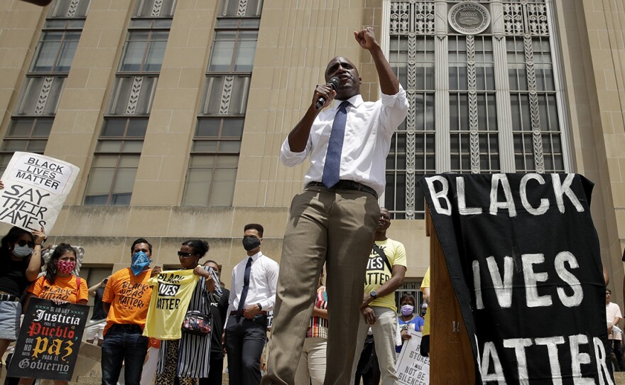 Mayor Quinton Lucas talks to demonstrators during a rally on the steps of city hall in Kansas City, Mo. on June 5.