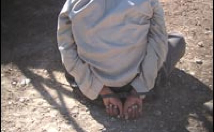 A suspected insurgent, detained in Mosul by the 2-7 Cavalry, is blindfolded and handcuffed.