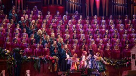 The Tabernacle Choir and Orchestra along with children dancing at Temple Square in "Season of Light: Christmas with The Tabernacle Choir"
