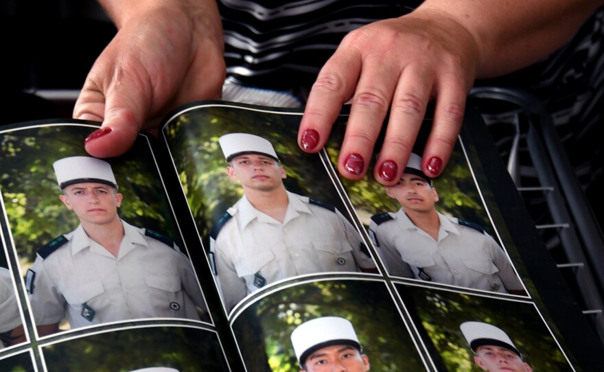 Oksana shows a photo of her son in his French Foreign Legion uniform.