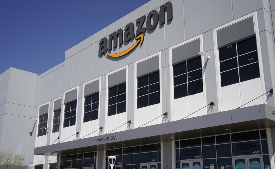 A worker walks out of an Amazon warehouse in North Las Vegas on March 31.