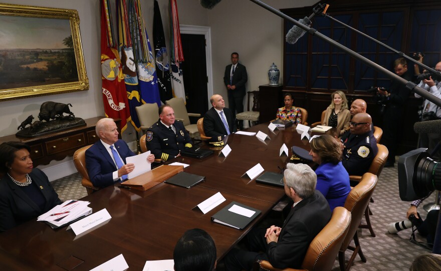 President Biden hosts a meeting that includes White House counsel Dana Remus.