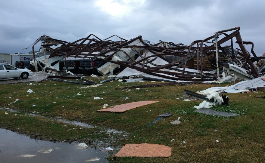 The remains of a tornado-damaged building in Alexandria, La., on Monday, after storms went through the Deep South and killed three people.