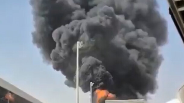 This image from video obtained and verified by AP shows thick black smoke and flames rising from a fire at King Khalid International Airport in Riyadh, Saudi Arabia, Friday, Oct. 9, 2026.
