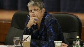 University of California President Janet Napolitano listens as student speakers denounce her plan to raise tuition during a meeting of the university Board of Regents in San Francisco, Nov. 19, 2014.