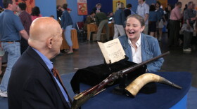 At "Antiques Roadshow" in Providence, Rhode Island, appraiser Bill Guthman hits the bull's eye when he targets a rare Mathewson rifle, powder horn and log book. Guthman attributes the items, handed down through seven generations of the owner's family, to Welcome Mathewson, one of early 19th-century New England's premier gunsmiths. Declaring the item a "national treasure," and one of the most rare and valuable firearms objects ever appraised on ROADSHOW, Guthman values the collection at $100,000 to $120,000.