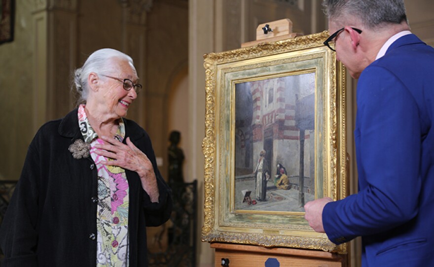 David Weiss (right) appraises a Charles Wilda "The Hour of Prayer" oil, ca. 1885 at Philbrook Museum in Tulsa, Okla.