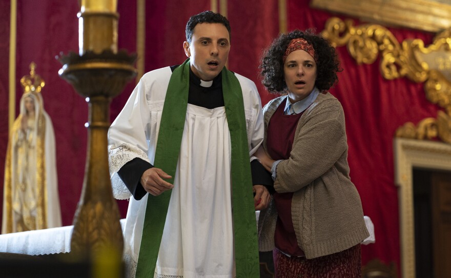 Jean Baptiste Fillon as Fr. Durand and Corinne Jaber as Paulette in THE MADAME BLANC MYSTERIES Season 1, Episode 5