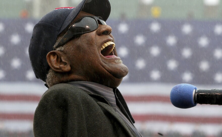 Ray Charles sings "America The Beautiful," in the rain at Fenway Park in Boston, April 11, 2003. Charles was posthumously inducted into the Country Music Hall of Fame on Sunday, May 1, 2022, in Nashville, Tenn., along with The Judds.