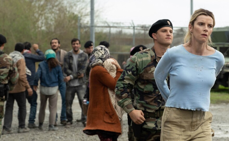 Crystal (Betty Gilpin, far right) finds herself the prey in a lethal game that is the focus of the film "The Hunt."