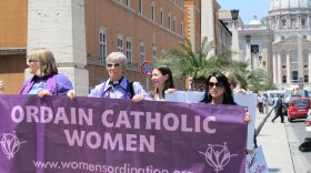 Representatives of the U.S.-based Women's Ordination Conference protest in front of St. Peter's Basilica at the Vatican. The group's executive director said the Vatican has turned a blind eye to male priests who "destroy the lives of children and families, but jumps at the chance to excommunicate women."