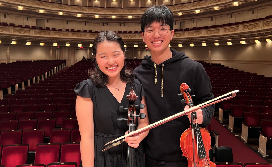 Jiin Yun, 16, is a senior cellist, and Jaden Kim, 16, is a junior violinist in the National Youth Orchestra. Both attend the Orange County School of the Arts in Santa Ana, Calif. Seen here at New York's Carnegie Hall in an undated photo.