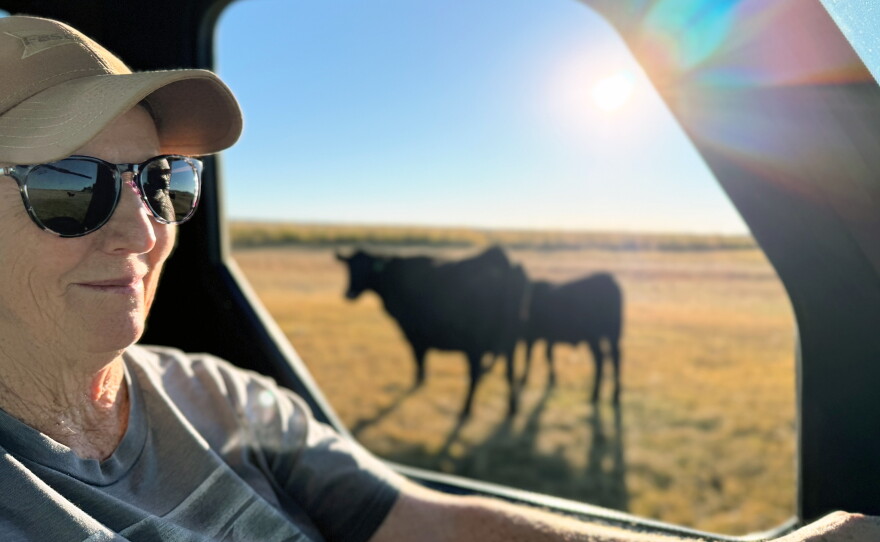 Katie Baltzor rides her side-by-side among the black angus cattle she raises near her home outside of Hines, Oregon.