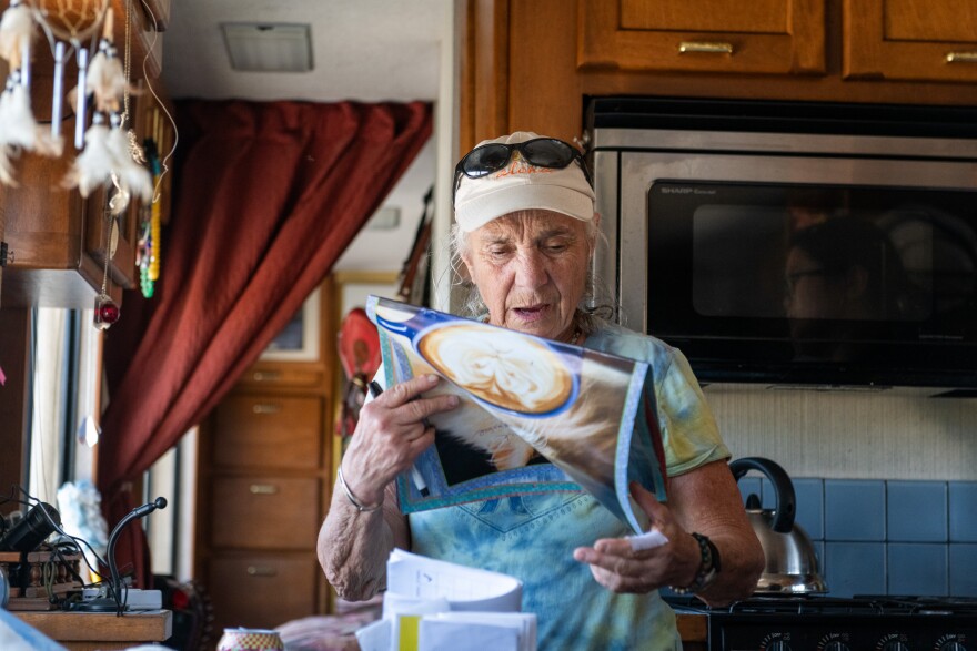 Susan Costanzo, 68, at her trailer home in Campo, Calif., on May 30, 2024. Costanzo checks her calendar to set up the next appointment with the rural health discharge team.<br/>