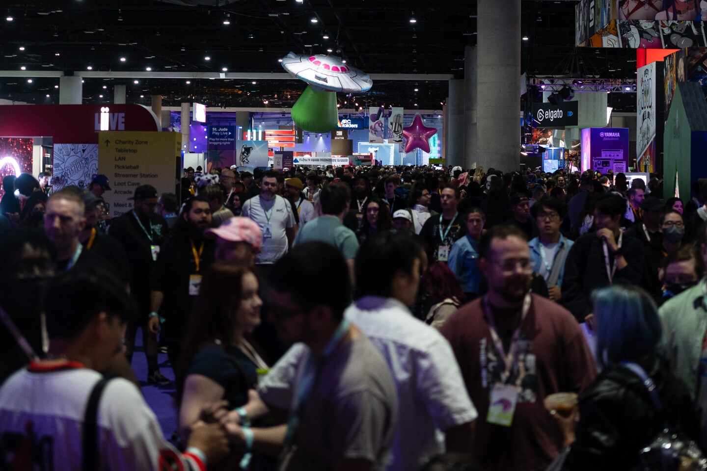 Thousands of TwitchCon attendees wander around the main exhibit hall at the San Diego Convention Center on Oct. 17, 2025.