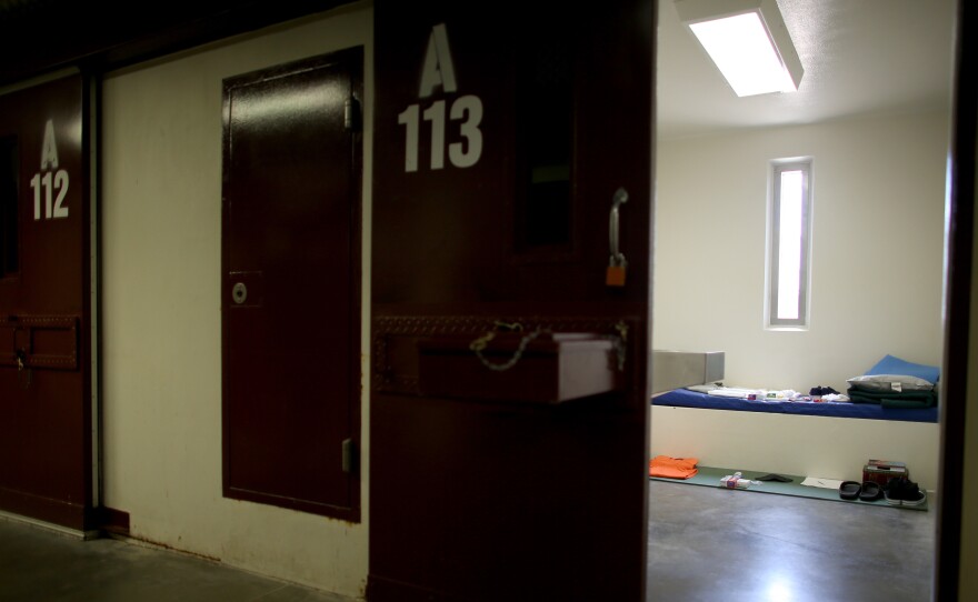 A static display shows the belongings of a typical inmate in a prison cell at camp V at the U.S. military prison in Guantanamo Bay, Cuba, in 2013.