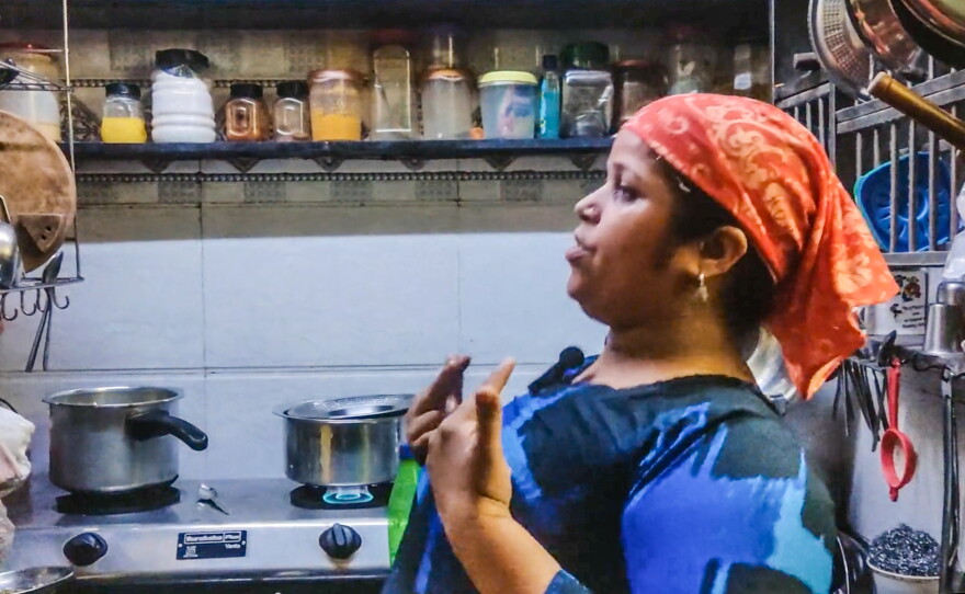 Rehana Shaikh has her star moment as she dances in her family's kitchenette while preparing dinner.