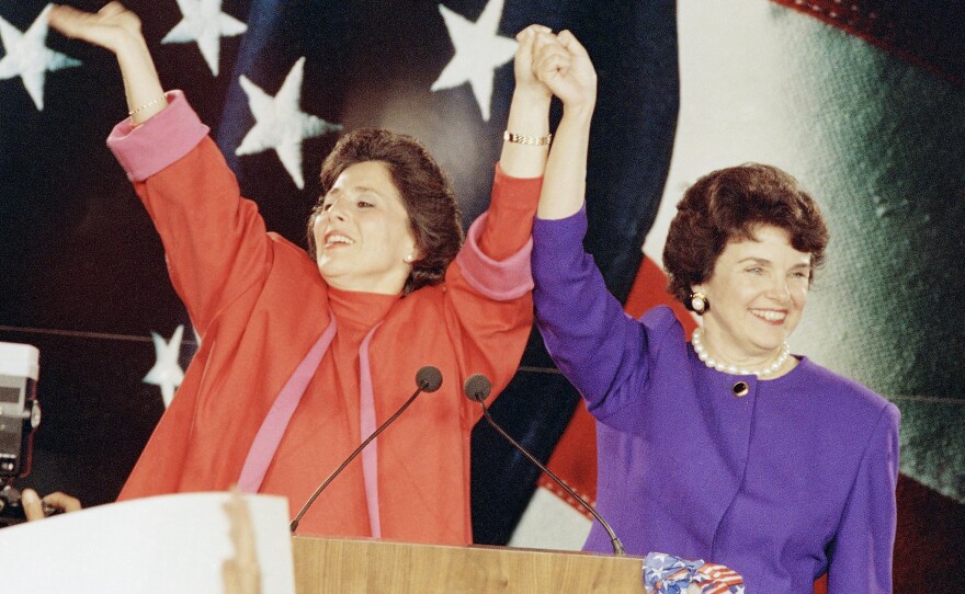 Democratic Senate candidates Barbara Boxer (left) and Dianne Feinstein raise their arms in victory at an election rally in San Francisco on Nov. 4, 1992, the so-called "Year of the Woman" in politics.