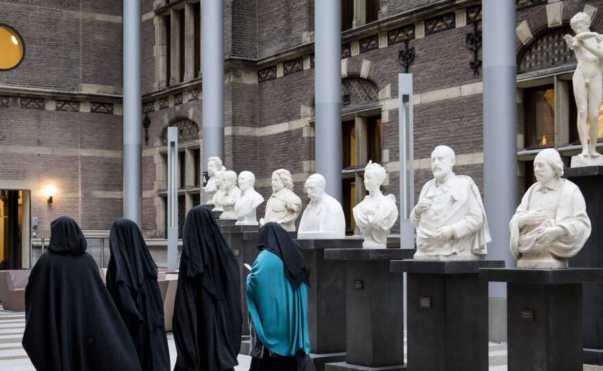 A European court has sided with employers who restrict Muslim women from wearing Islamic headscarves. Here, women wearing niqab visit the Dutch Senate last November, as restrictions on Islamic head coverings were being debated.