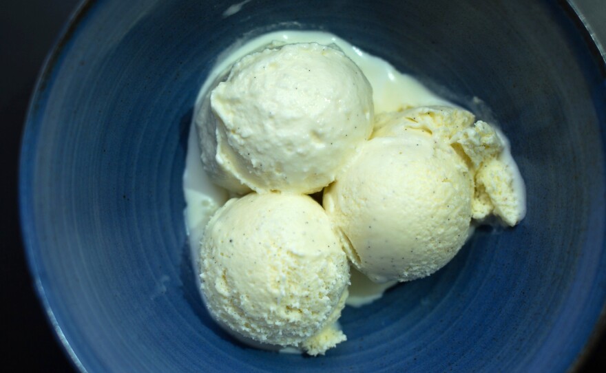 Three scoops of vanilla ice cream made with vanilla beans from Mexico, Tahiti, and Madagascar.