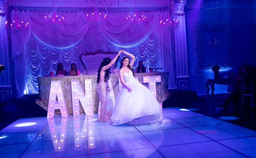 Leticia Sareñana spins her daughter Anahi Sareñana during the first waltz, at Factory of Dreams Hall in Chula Vista. This dance is the first dance of a quinceañera, has traditionally a father-daughter or mother-daughter dance.