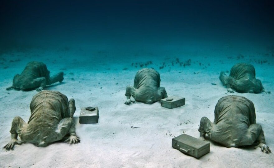 The Banker, by Jason deCaires Taylor, off the coast of Cancun, Mexico.