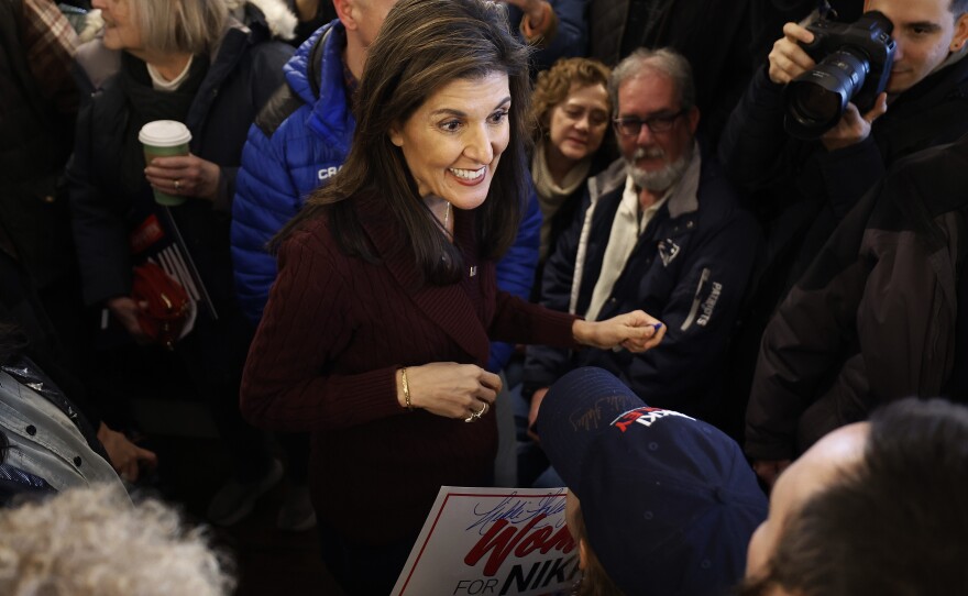 Republican presidential candidate and former UN Ambassador Nikki Haley talks with people at the historic Robie Country Store on January 18, 2024 in Hooksett, New Hampshire.