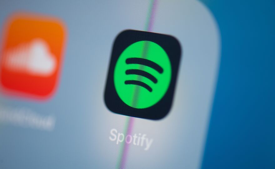 Spotify says it will add a content advisory to podcasts that discuss COVID-19.
