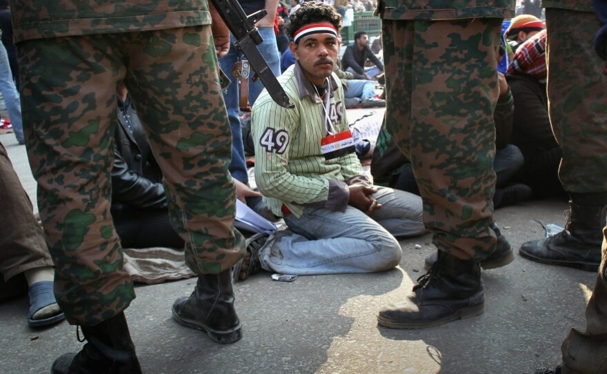 Egyptians stage a sit-in after the army ordered their encampments torn down in Tahrir Square on Sunday.