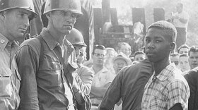Fifteen-year-old Terrence Roberts (right) is denied entrance to Little Rock Central High School by the National Guard in 1957.