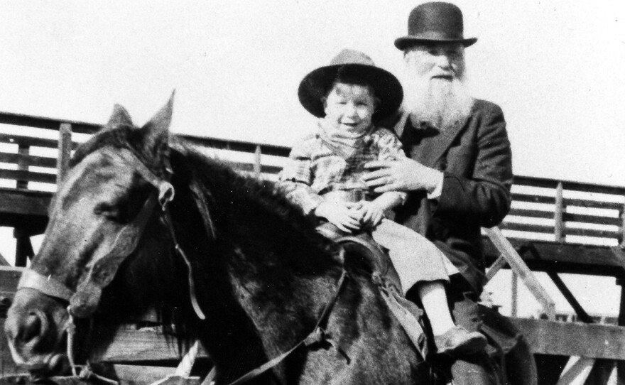 Jewish cattle rancher Robert Lazar Miller on horseback with his grandson at the Denver Stockyards, 1932.