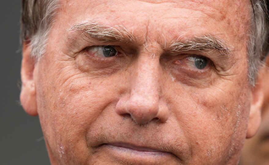 FILE - Brazil's former President Jair Bolsonaro, temporarily allowed out of house arrest for medical treatment, departs a hospital in Brasilia, Brazil, Sept. 14, 2025.