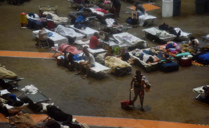 Residents seek shelter inside Roberto Clemente Coliseum in San Juan, Puerto Rico, early on Wednesday, as Hurricane Maria struck the island.