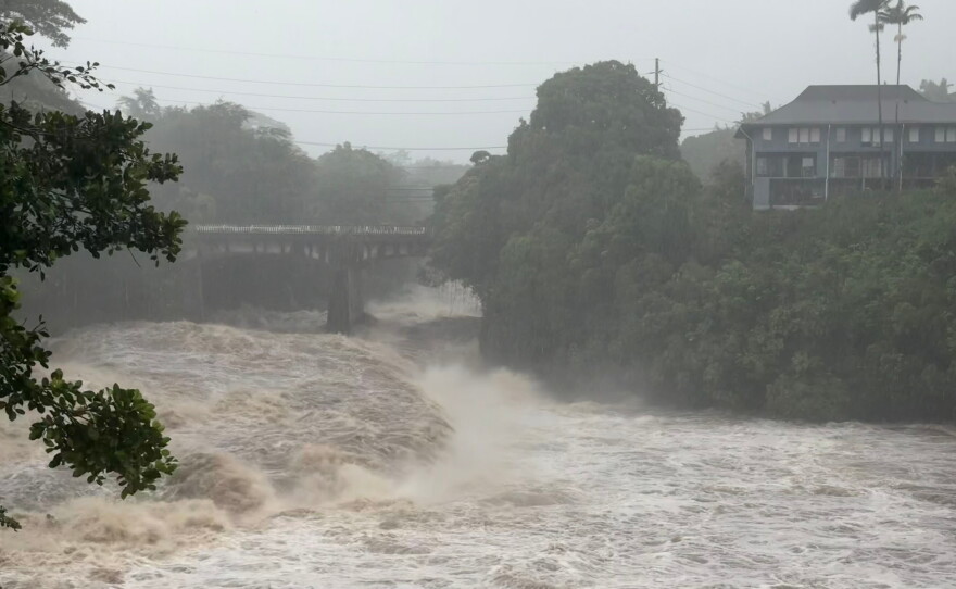 A view of the rising water levels at the Wainaku Street Bridge in Hilo on the Big Island of Hawaii, Saturday, Aug. 15, 2026.