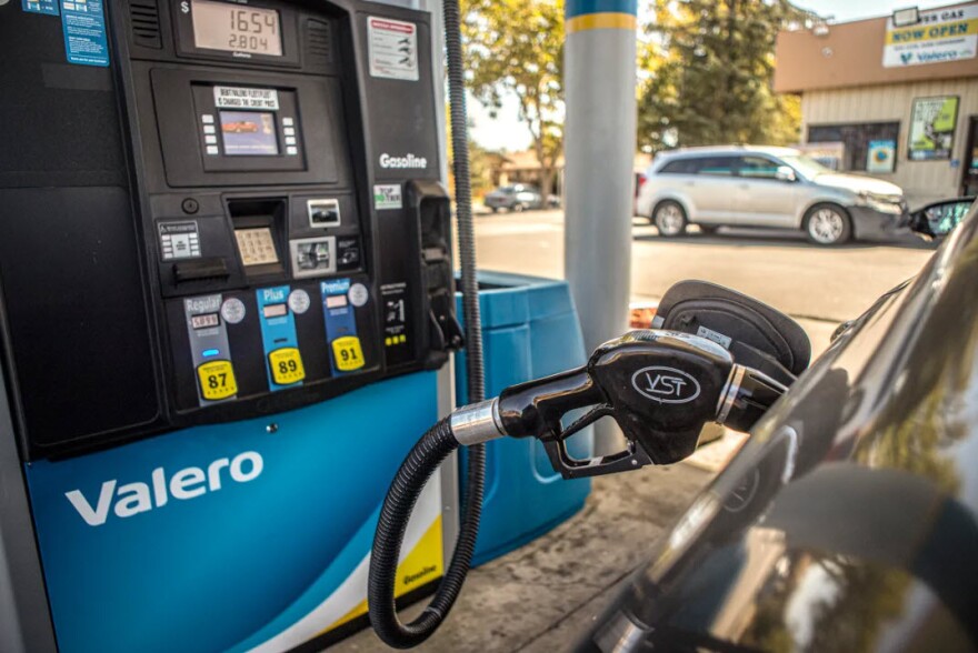 A gas nozzle in a vehicle at a central Fresno gas station on Sept. 29, 2022.