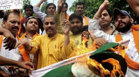 Indian activists of the right-wing Hindu organization Shiv Sena shout slogans as they burn a Pakistani national flag during a protest in Amritsar in September.