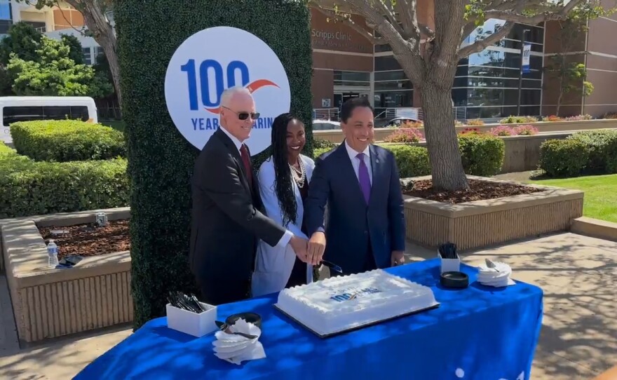 Scripps Health CEO Chris Van Gorder (left) and San Diego Mayor Todd Gloria (right), along with Dr. Ayana Boyd King, Scripps Memorial Hospital La Jolla's chief of staff, cut a birthday cake for the hospital's centennial celebration on Sept. 17, 2024.