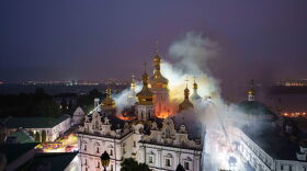 Rescue workers try to put out a fire at the Dormition Cathedral of thousand-year-old Monastery of Caves, also known as Kyiv Pechersk Lavra, following a Russian strike on Kyiv, Ukraine, Monday, June 15, 2026.