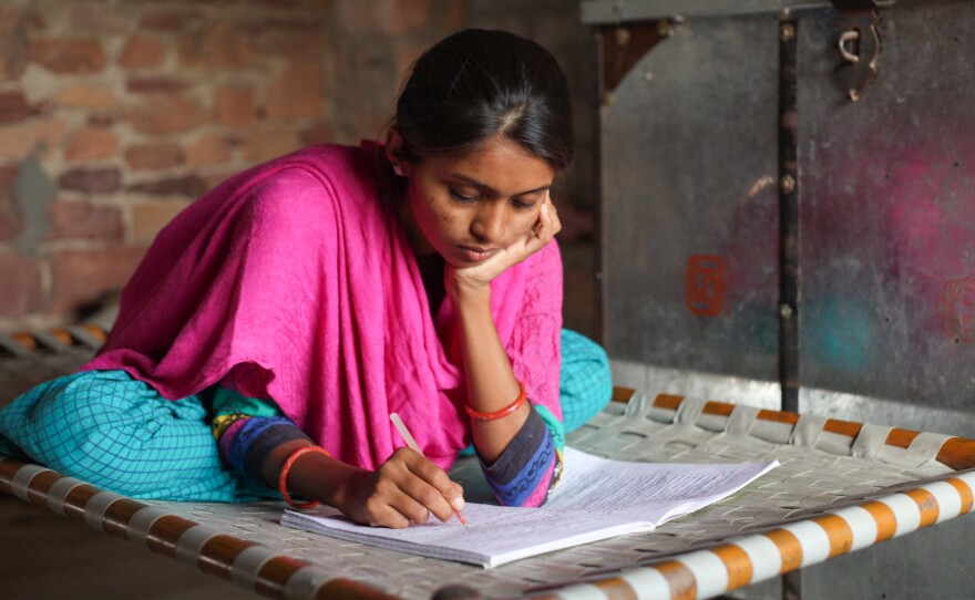 Durga studies for final exams in her second year of college.